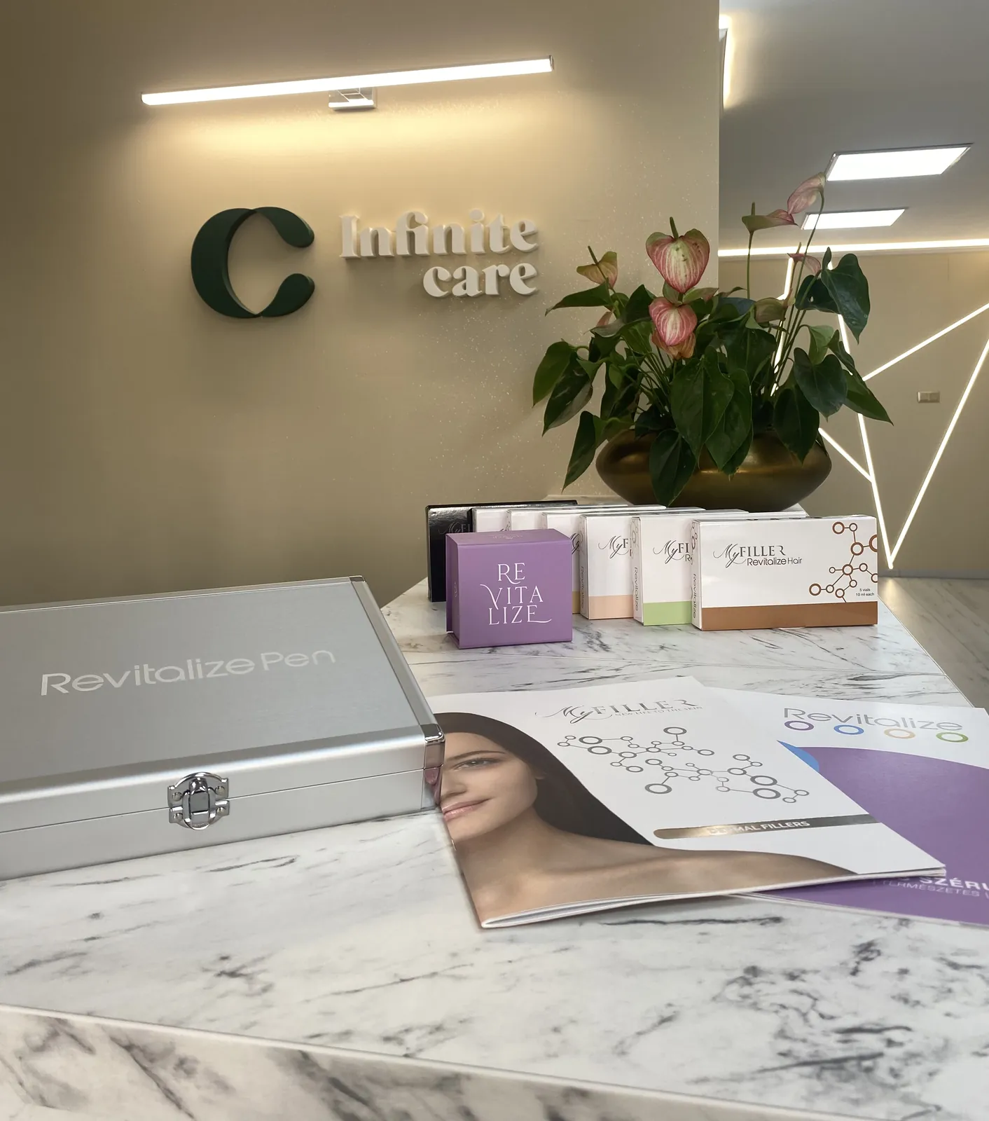 Reception with the Infinite Care logo wall